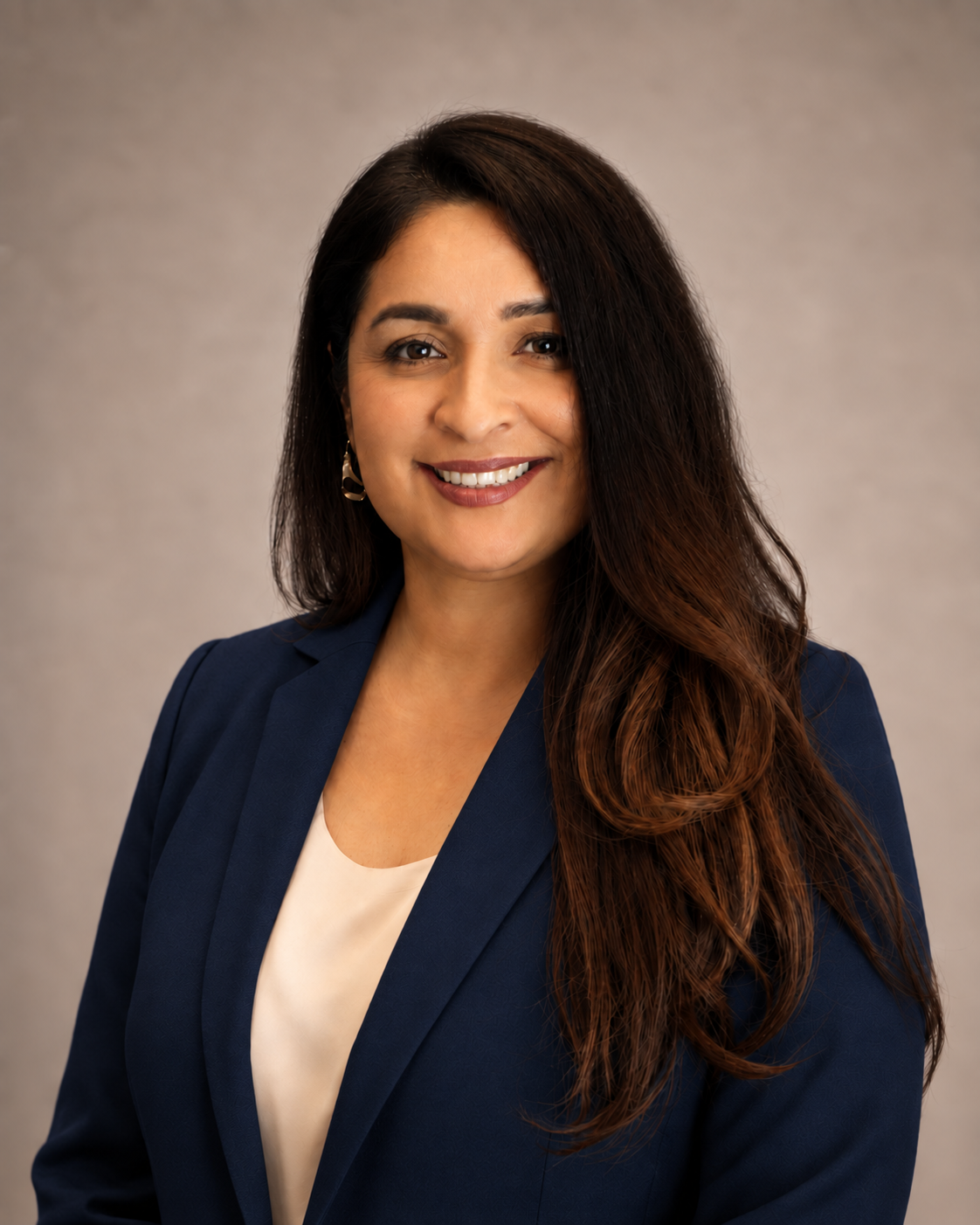 Portrait of Yajaira De La Paz in a navy blazer